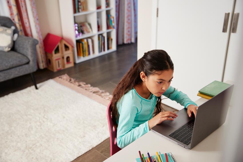 girl using a laptop computer